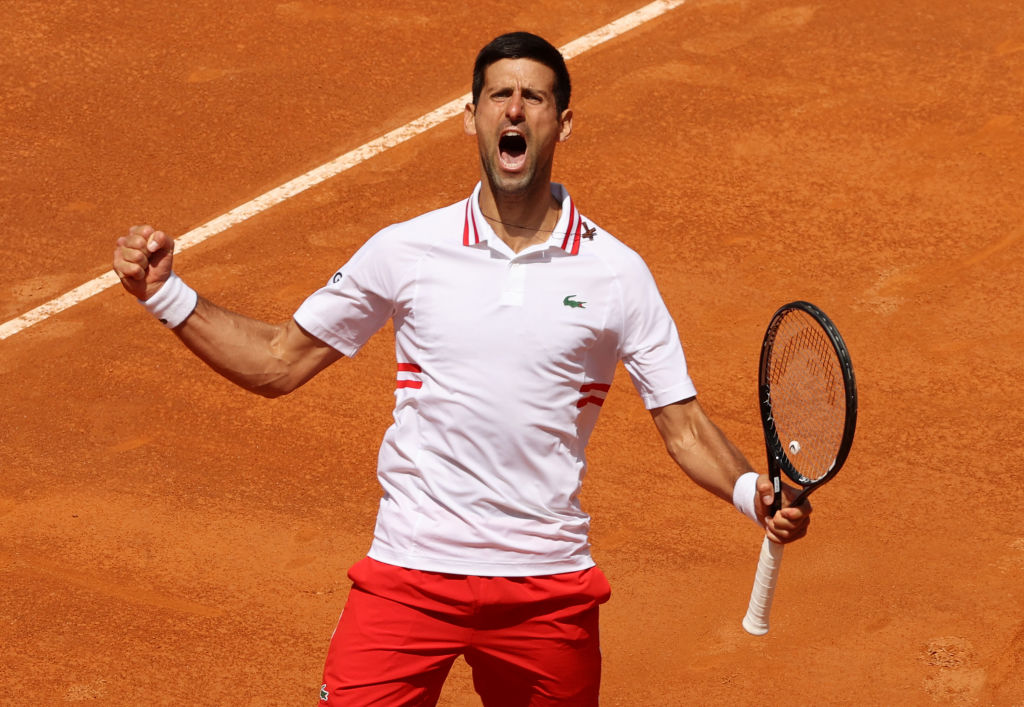 ROME, ITALY - MAY 15: Novak Djokovic of Serbia celebrates winning the second set during his match with Stefanos Tsitsipas of Greece on Day Eight of the Internazionali BNL D'Italia 2021 at Foro Italico on May 15, 2021 in Rome, Italy. Sporting stadiums around Italy remain under strict restrictions due to the Coronavirus Pandemic as Government social distancing laws prohibit fans inside venues resulting in games being played behind closed doors. (Photo by Clive Brunskill/Getty Images)