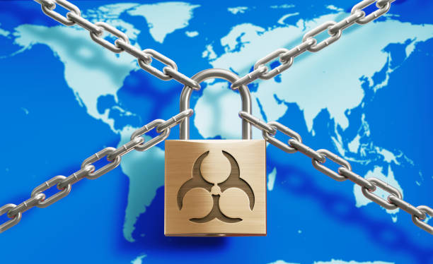 Padlock and chain on geographical world map, Horizontal composition with copy space. COVID-19 pandemic lock down and social distancing concept.