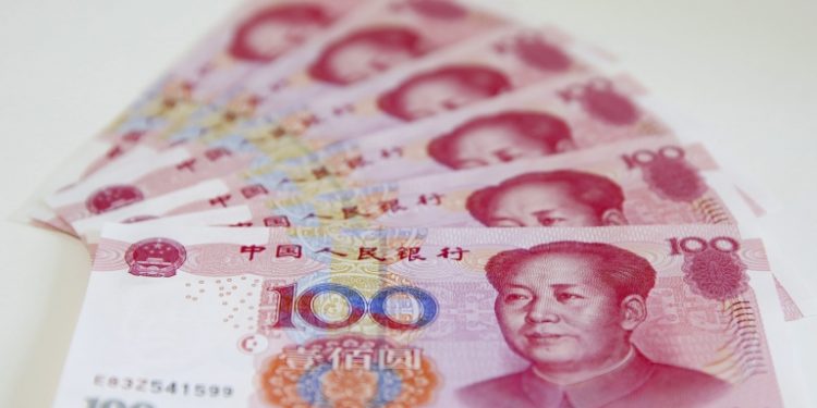 epa04986231 (FILE) A file picture dated 12 August 2015 shows Chinese yuan banknotes in Beijing, China, 12 August 2015. According to media reports on 21 October 2015, People's Bank of China (PBC or PBOC), the central bank of China, launched a yuan-denominated bond auction in London, Britain. The move, said to be made for the first time outside of China, intends to internationalize China's currency facilitating cross-border trade and investment in the offshore market. The note, worth five billion yuan (about 690 million euro or 786 million US dollar), has an interest rate of 3.15 percent and its falls are due in 2016. The central bank's announcement was made as Chinese President Xi Jinping is in Britain on a four-day official visit.  EPA/WU HONG