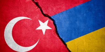 Turkey and Armenia conflict. Country flags on broken wall. Illustration.