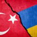 Turkey and Armenia conflict. Country flags on broken wall. Illustration.