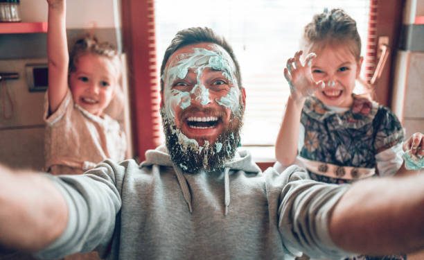 Selfie By Father With Cute Child Daughters After Cooking And Making Mess With Topping
