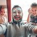 Selfie By Father With Cute Child Daughters After Cooking And Making Mess With Topping