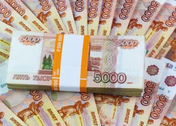 Half a million Russian rubles scattered on the table. The tutu in the banking package for the five thousandth bills fan