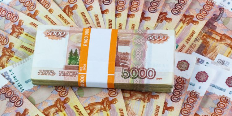Half a million Russian rubles scattered on the table. The tutu in the banking package for the five thousandth bills fan